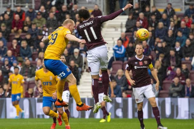 Chris Burke heads home the winner at Tynecastle on Saturday. Picture: SNS.
