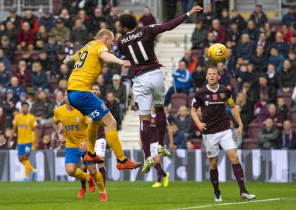 Chris Burke heads home the winner at Tynecastle on Saturday. Picture: SNS.
