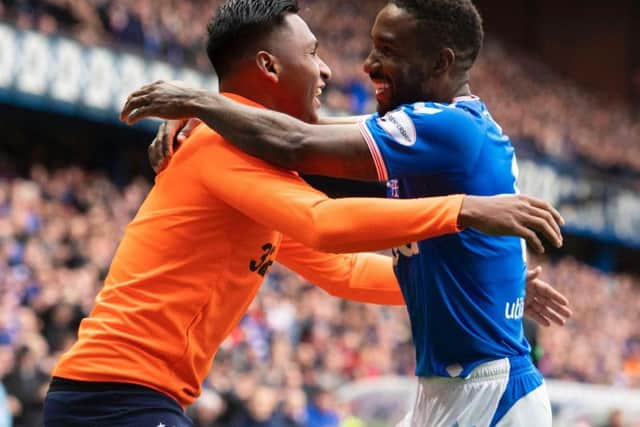 Jermain Defoe embraces Alfredo Morelos after completing his hat-trick.