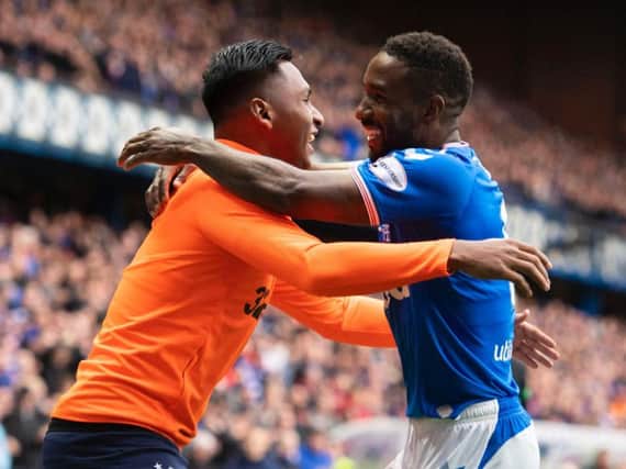Jermain Defoe embraces Alfredo Morelos after completing his hat-trick.