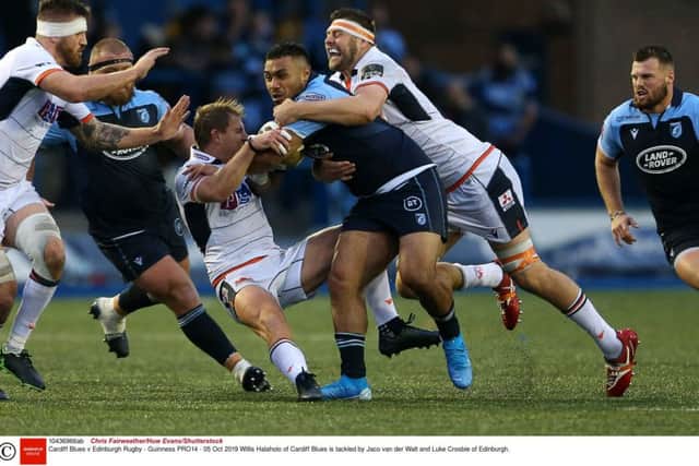 Edinburghs Jaco van der Walt and Luke Crosbie combine to thwart Cardiffs Willis Halaholo. Picture: Chris Fairweather/Huw Evans/Shutterstock.