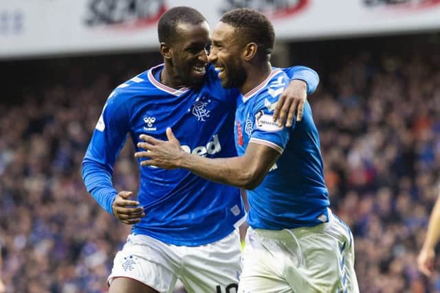 Jermain Defoe, right, celebrates with team-mate Glen Kamara after completing his hat-trick to make it 5-0 to Rangers. Picture: SNS