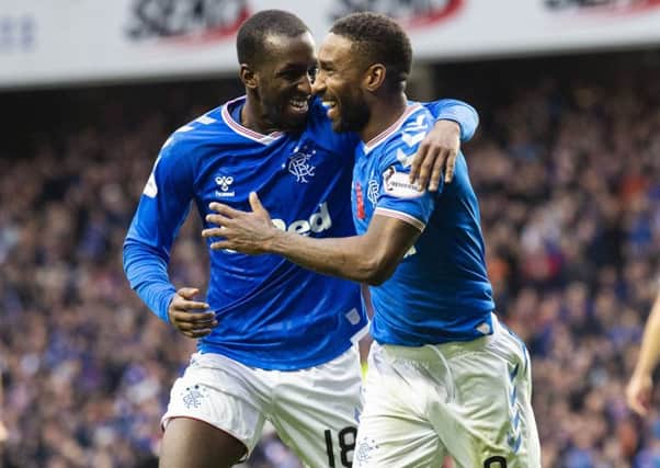 Jermain Defoe, right, celebrates with team-mate Glen Kamara after completing his hat-trick to make it 5-0 to Rangers. Picture: SNS