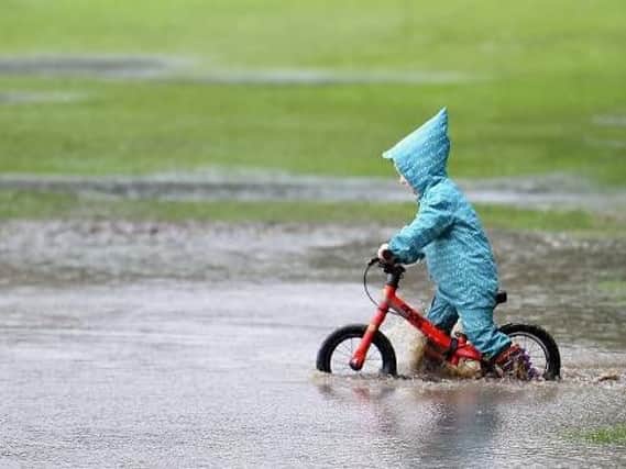 Some people don't mind the bad weather as much as others! Picture: Neil Hanna
