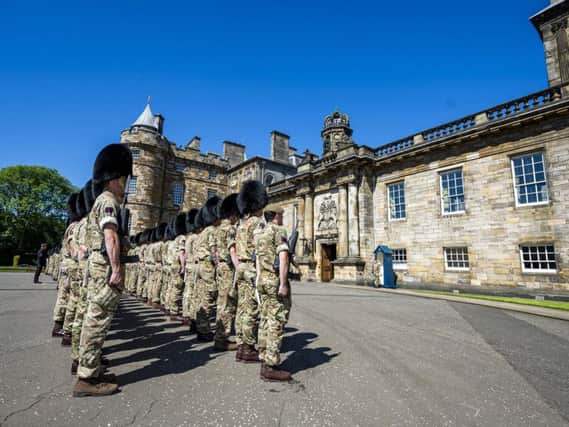 Scots Guards prepare to welcome the Queen. Picture: Cpl Nick Johns RLC