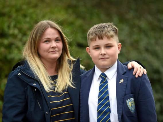 Kelly Smith was shocked when she found out teachers had ruled her 14-year-old son Jason Kirkbride's short back and sides was "inappropriate".