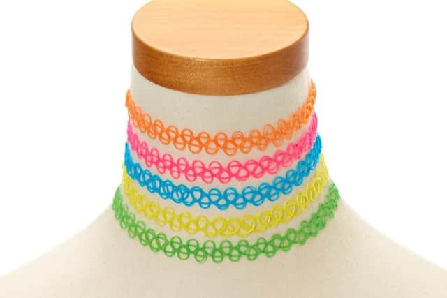These elastic chokers were all the rage for girls back in the 90s - you could choose from a variety of neon colours, or opt to stay more sophisticated with a plain black one