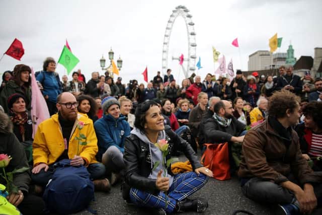 Activists gather on Westminster Bridge during a demonstration by climate change group Extinction Rebellion in central London, earlier this month. (Photo by ISABEL INFANTES/AFP via Getty Images)