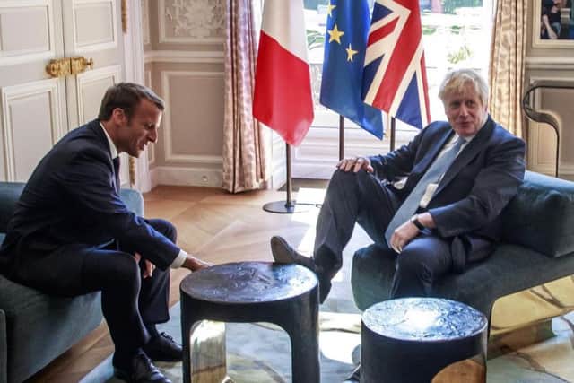 Emmanuel Macron and Boris Johnson share a joke during the UK Prime Minister's visit to Paris
