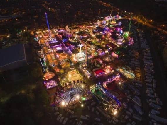 It is believed the woman fell from one ride onto the base of another nearby attraction at a travelling fairground yesterday evening.