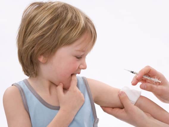 A child after receiving an immunisation jab