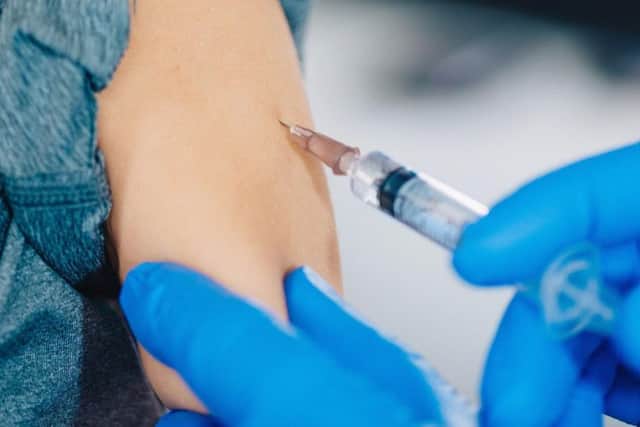 A child receives a vaccine