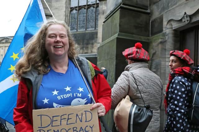 A pro-EU demonstrator outside Scotland's Court of Session where judges were considering a legal challenge designed to force Boris Johnson to obey the new Benn Act law (Picture: Andrew Milligan/PA Wire)