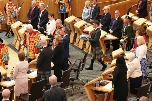 The Duke of Hamilton carries the Crown of Scotland into the Scottish Parliament