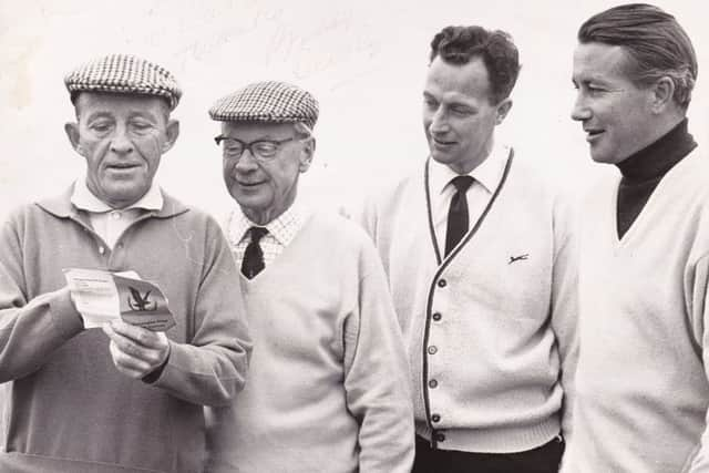 Ian Marchbank looks on as Bing Crosby checks his scorecard