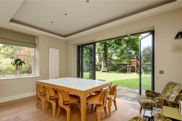 The kitchen has a dining area and sliding doors to the garden.