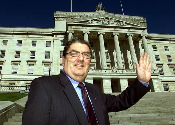 Former SDLP leader John Hume in front of the Stormont building near Belfast in 2002. Picture: PA