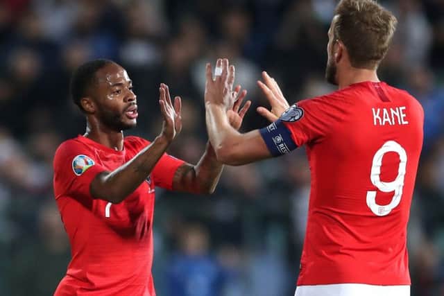 Raheem Sterling and Harry Kane celebrate in a match marred by racist abuse from Bulgarian fans (Picture: Nick Potts/PA Wire)