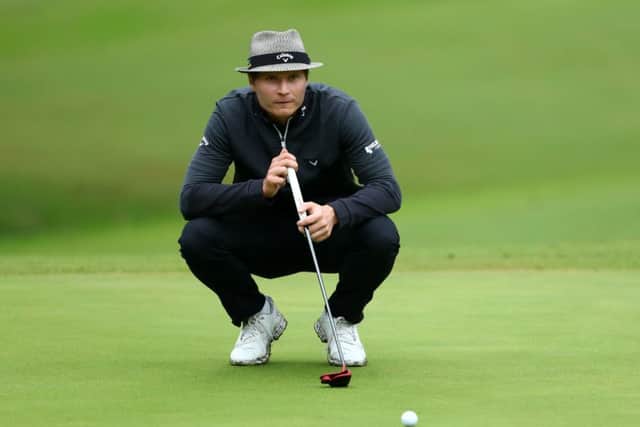 Finland's Tapio Pulkkanen lines up a putt on the 17th green. Picture: Matthew Lewis/Getty
