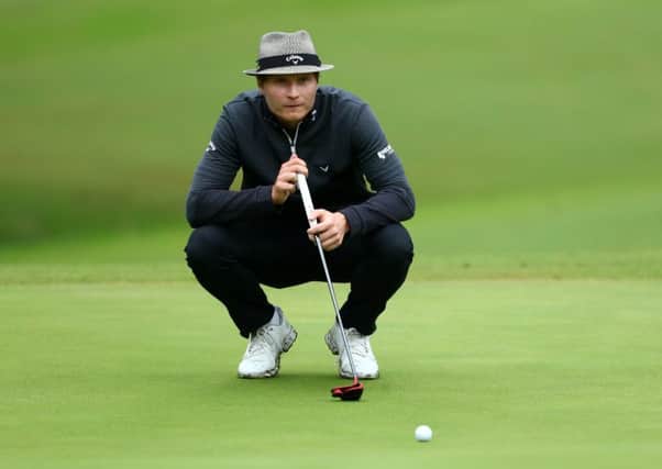 Finland's Tapio Pulkkanen lines up a putt on the 17th green. Picture: Matthew Lewis/Getty