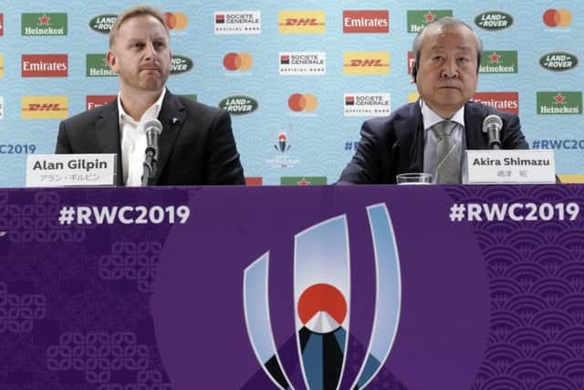 Alan Gilpin, left, tournament director for the 2019 Rugby World Cup and Japan Rugby 2019 CEO Akira Shimazu, right, give an update on Typhoon Hagibis. Picture: Eugene Hoshiko/AP