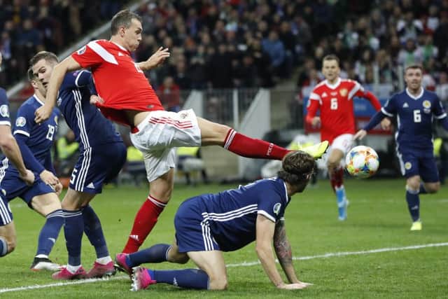 Russia's Artem Dzyuba, second left, scores his side's third goal. Picture: AP