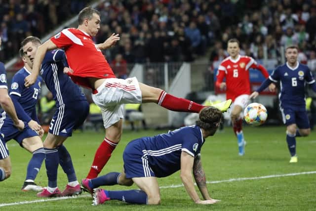 Russia's Artem Dzyuba, second left, scores his side's third goal. Picture: AP