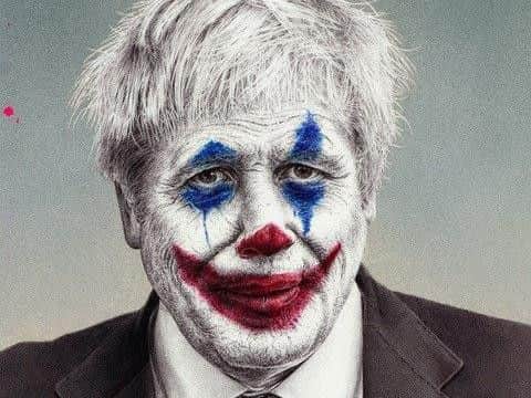 James Mylne of his the detail of his new artwork depicting Prime Minister Boris Johnson as comic book character The Joker. Picture: PA
