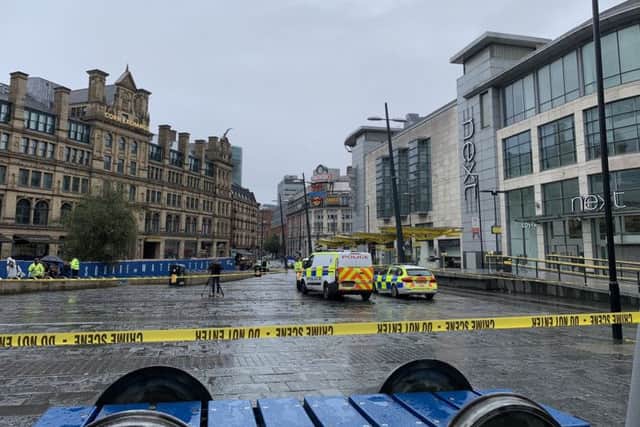 Police vehicles outside the Arndale Centre in Manchester where at least four people have been treated after a stabbing incident. Picture: @xkimdunnell/PA Wire