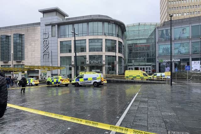 Ppolice vehicles and ambulances outside the Arndale Centre in Manchester where at least four people have been treated after a stabbing incident. Picture: @xkimdunnell/PA Wire
