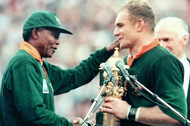 Nelson Mandela presents François Pienaar with the William Webb Ellis trophy after South Africa's win over New Zealand in the 1995 Rugby World Cup final. Picture: Jean-Pierre Muller/AFP