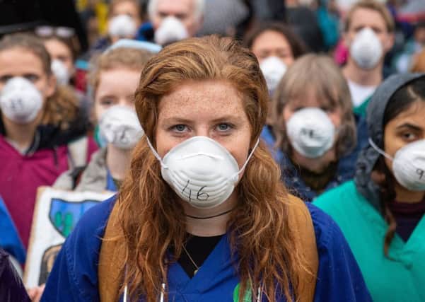 Doctors protest in support of Extinction Rebellion in London to highlight deaths caused by air pollution. (Picture: Dominic Lipinski/PA Wire)
