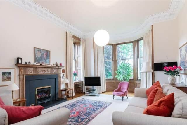 The drawing room has bay windows and period features.
