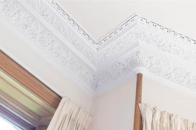 The drawing room has original ceiling cornicing.