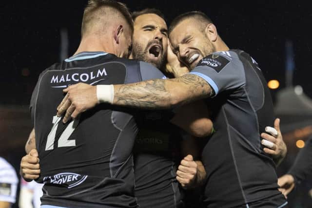 Nick Frisby is mobbed by team-mates after scoring Glasgow's second try against Cardiff. Picture: Alan Harvey/SNS