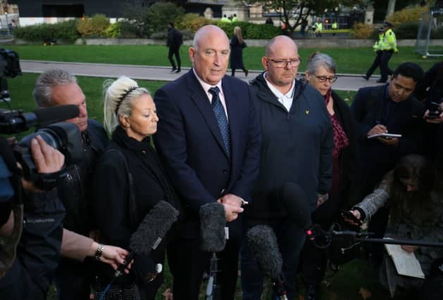 Spokesman Radd Seiger for the family of Harry Dunn, flanked by mother Charlotte Charles and father Tim Dunn. PA Photo
