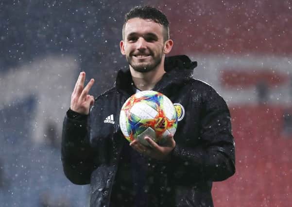 John McGinn poses with the match ball following his first-half hat-trick in Scotland's 6-0 rout of San Marino. Picture: Ian MacNicol/Getty Images