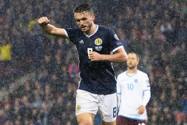 John McGinn celebrates after scoring the second of his three goals. Picture: Alan Harvey/SNS