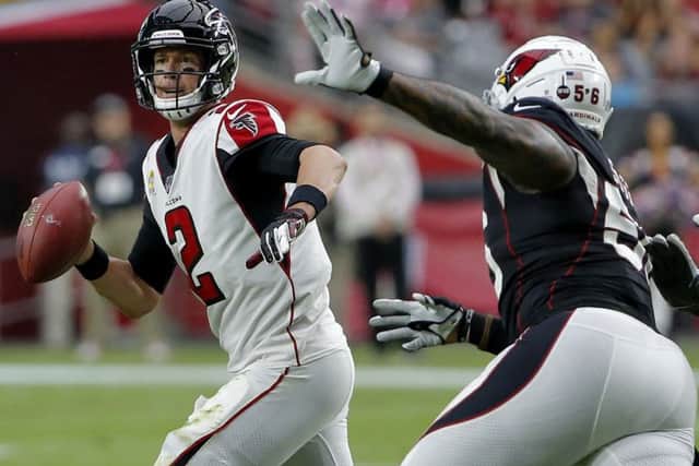 Atlanta Falcons quarterback Matt Ryan scrambles to avoid Arizona Cardinals linebacker Terrell Suggs. Picture: Rick Scuteri/AP