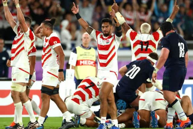 To the victors the spoils. Hosts Japan celebrate their 28-21 win over Scotland which sent them through to the last eight. Picture: Getty Images