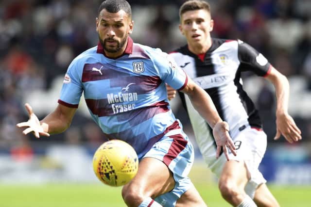 Steven Caulker, left, in action for Dundee in 2018. Picture: SNS