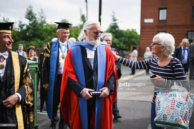 Billy Connolly is greeted by a fan while receiving an honorary degree in Glasgow. Picture: Getty