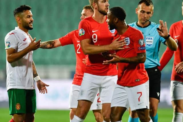England forward Raheem Sterling argues with Bulgaria midfielder Wanderson during the UEFA Euro 2020 qualifier on Monday. Picture: Getty Images