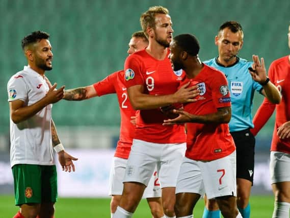England forward Raheem Sterling argues with Bulgaria midfielder Wanderson during the UEFA Euro 2020 qualifier on Monday. Picture: Getty Images