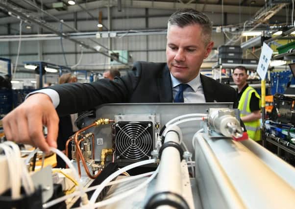 Finance Secretary

Derek Mackay gets his hands on a nitrogen generator during a vist to Peak Scientific UK in Edinburgh. (Picture: John Devlin)