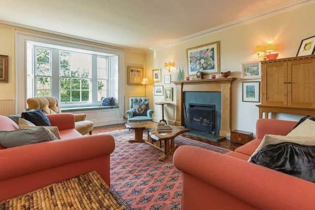 There is also a sitting room, which has a feature fireplace.