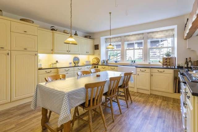 The kitchen has space for a dining table - ideal for family or informal dining.