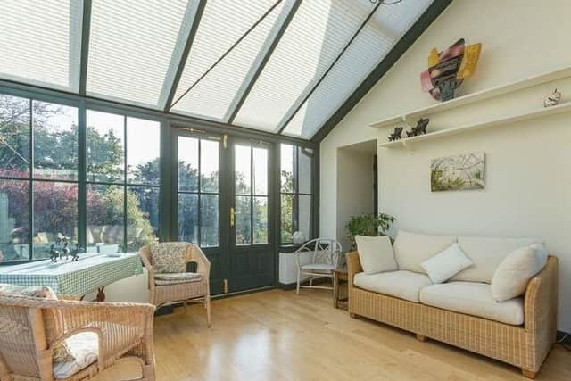 The conservatory offers an extra living and dining room and has direct access to the garden.