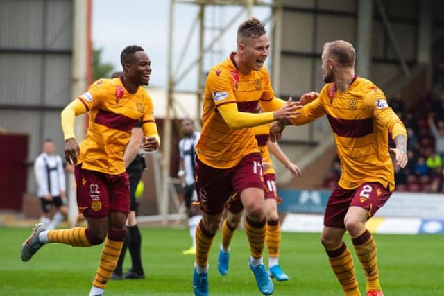 James Scott celebrates with his Motherwell team-mates after putting the Fir Park side 1-0 up against St Mirren.