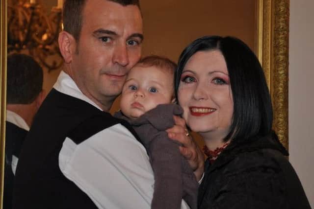 David Haines, pictured with his wife, Dragana, and daughter, Athea